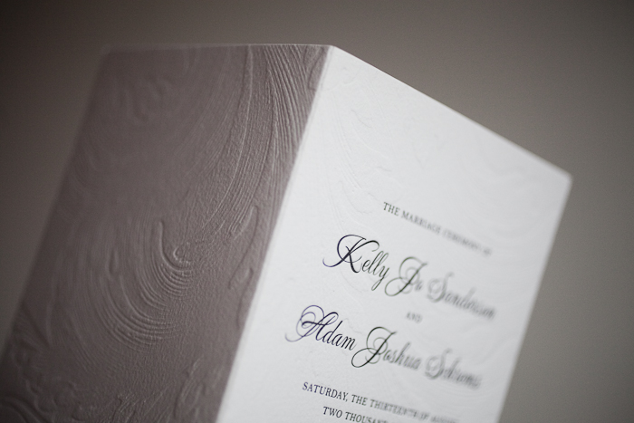 blind deboss and classic black letterpress wedding programs