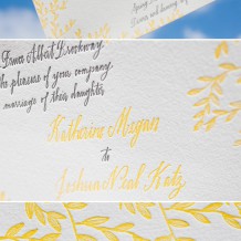 This wedding invitation customization of Bella Figura's Gramercy design is letterpressed in pewter and yolk inks.