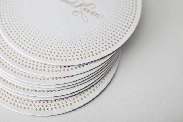 Foil stamped coasters from Bella Figura, featuring the Champagne design, printed on 100% recycled coaster stock